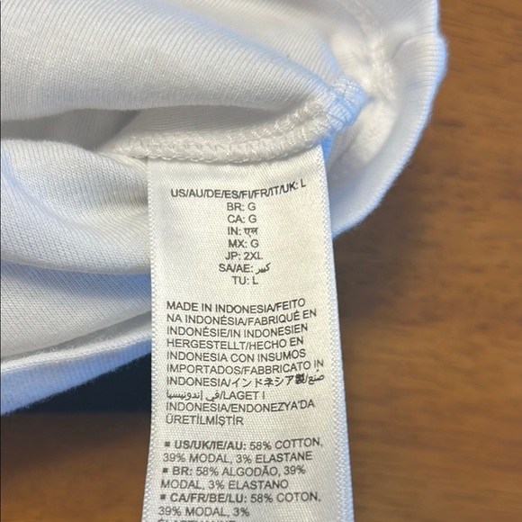 Women large Amazon tops in white and black. One top has a wider neckline. - Picture 13 of 14